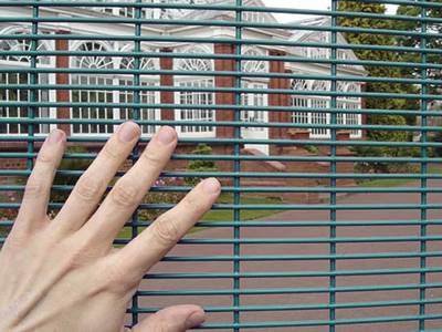 The spacing between horizo<em></em>ntal wires of 358 security mesh is smaller than a man's finger.