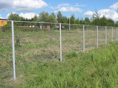 This is welded wire agricultural fencing in farmland.