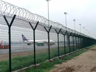 This is airport with concertina razor welded wire fencing.