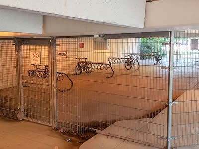 This is a bicycle parking with welded wire fence.