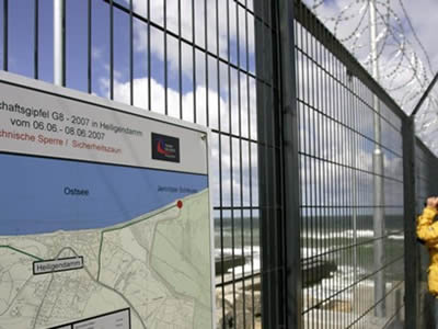 This is welded wire fence with concertina razor wire in the port.