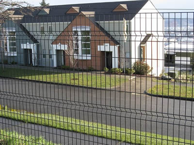 This is a beautiful house with single welded wire fence.