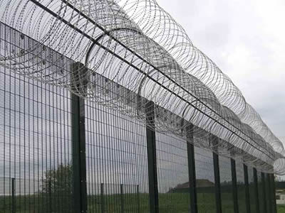 This is welded wire military fence with concertina razor wire.