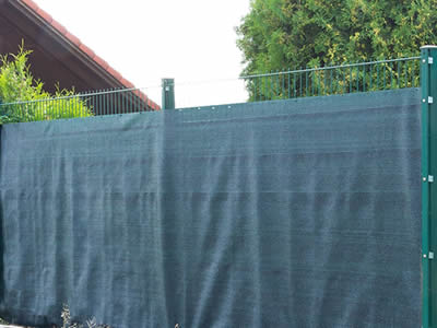 This is a windbreak fencing as wall of house.